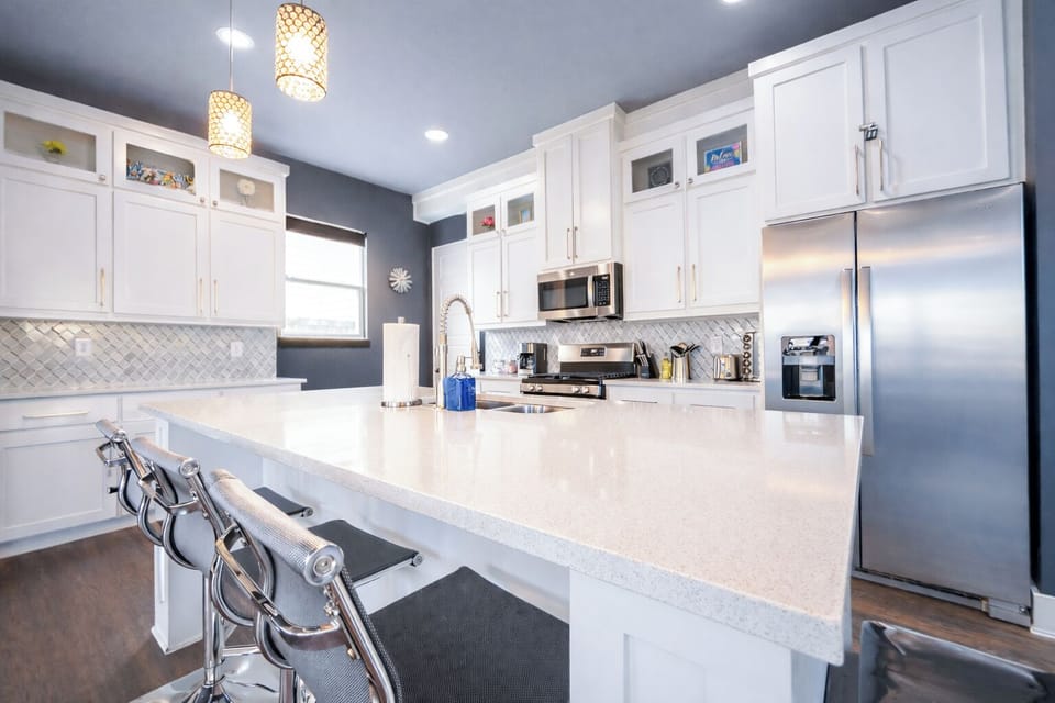 Multiple large countertop areas make food prep and presentation a breeze. 