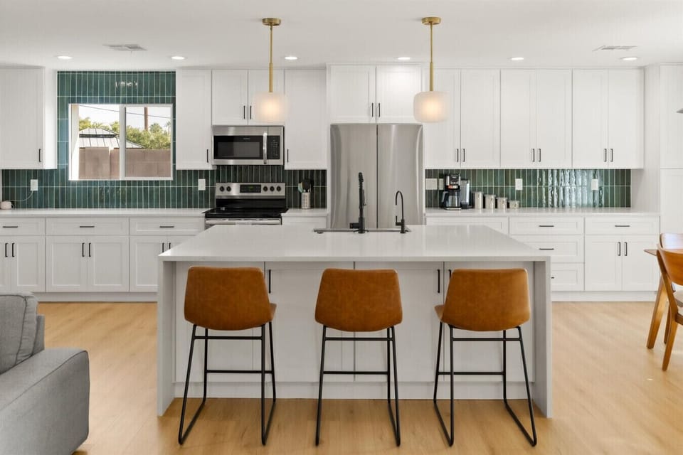 This modern kitchen has plenty of counter space and high-end appliances for the home chefs.