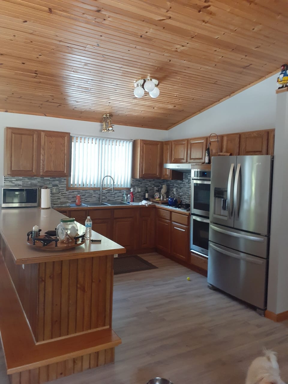 Micro, dishes, silverware, pots, pans, double oven, dishwasher, toaster, drinks.