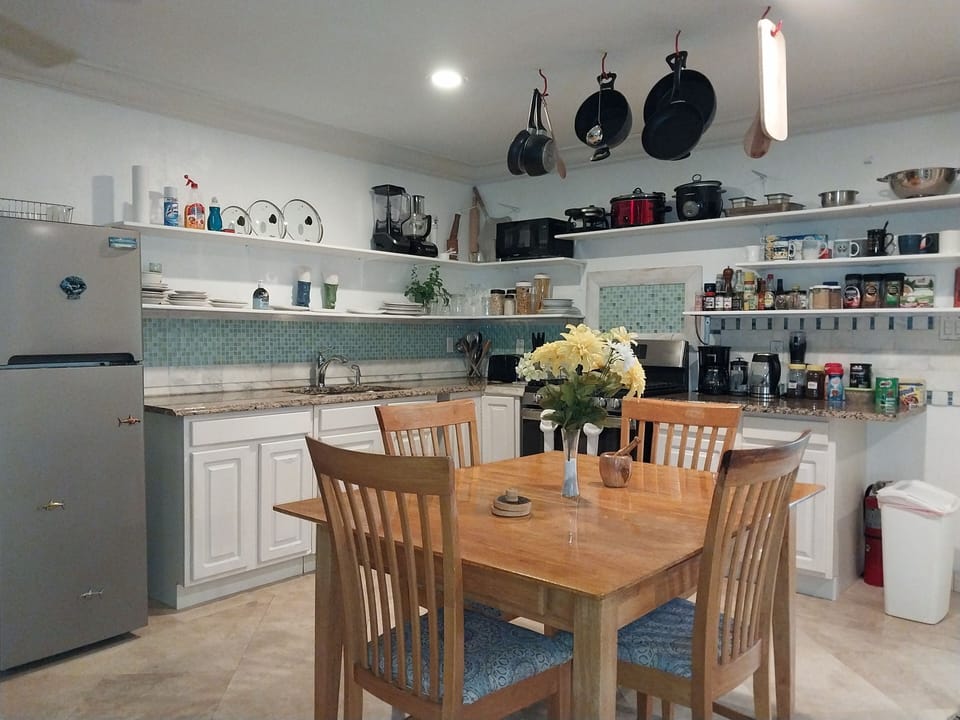 Dining table and kitchen areas