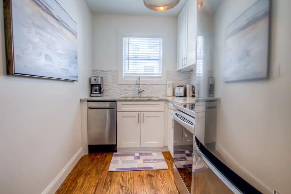 Bright updated kitchen w/ new stainless steel appliances & granite countertops 