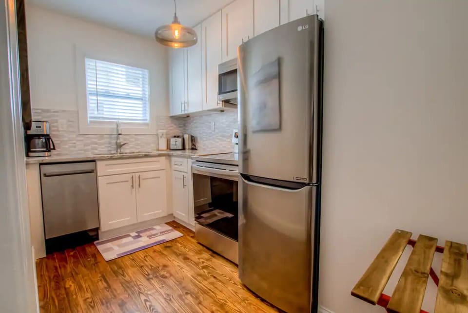 The renovated kitchen is stocked with essentials for your stay.