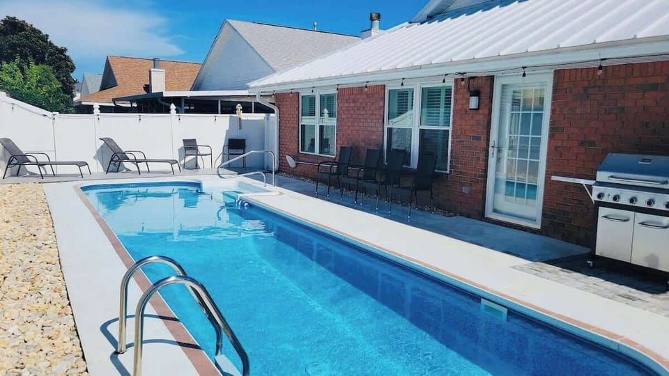 Awesome fenced back yard with private heated pool, gas BBQ grill, outdoor furniture