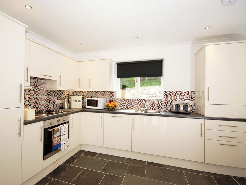 Kitchen area | Woodpecker - The Waterfront, Blackbridge, near Milford Haven