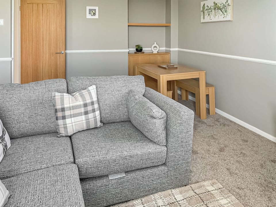 Living room/dining room | Sunrise Cottage - Bron Y Wendon Holiday Park, Llanddulas, near Llandudno
