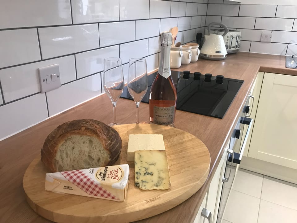 Kitchen -cheese and wine | Clock Tower Cottage, Whitchurch