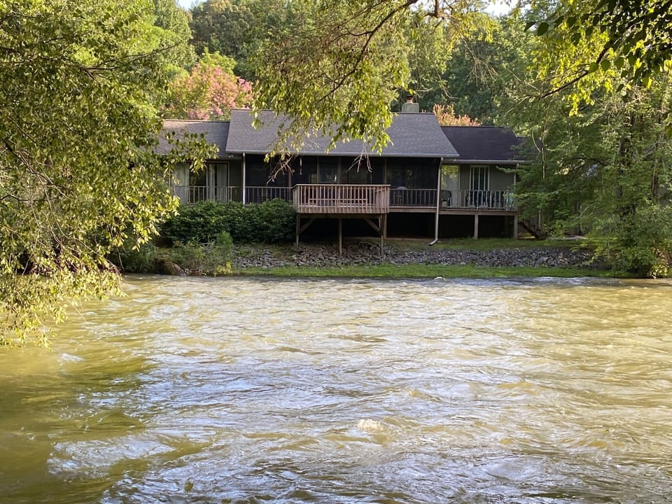 View of the cottage from across the river