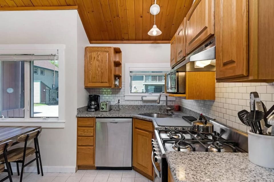 Kitchen with new stainless steel appliances and gas stove