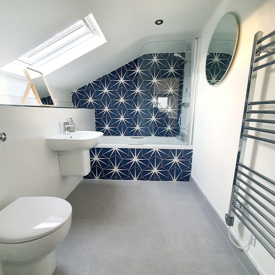 Ensuite to Bedroom 2. Power shower, bath with handles, heated towel rail.