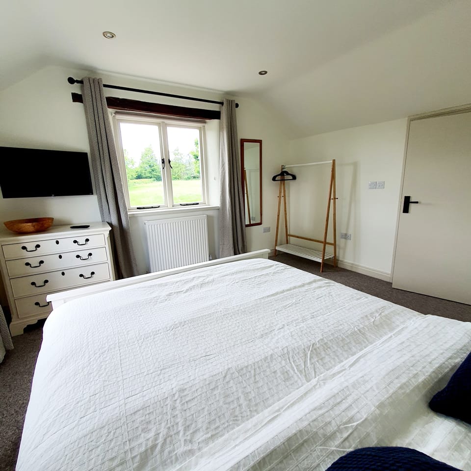 Bedroom 2 with views over field at front. Blackout blinds plus blackout curtains