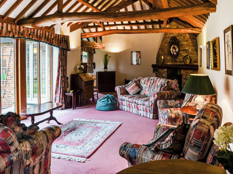This is the Jacuzzi bath in the master bedroom ensuite. | Lodge Farm Barn, South Walsham