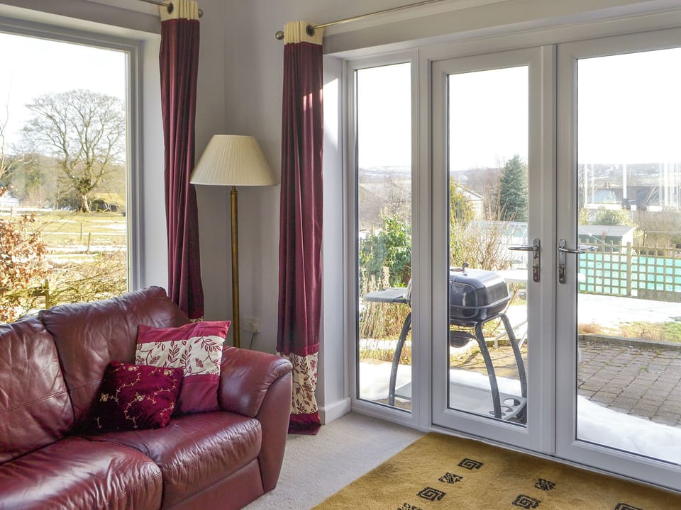 Sunroom with French doors to BBQ area | Heatherlea, Otterburn