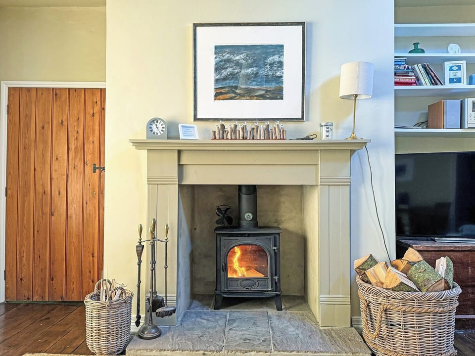 Wood-burning stove in the comfortable living room | Fallodon Burnhouses, near Beadnell