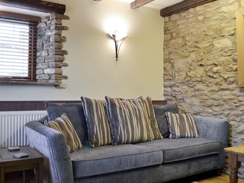Comfy seating and characterful exposed stone walls | Kimlin Cottage - Kimlin Cottage and Jenny Spring, High Yedmandale near West Ayton