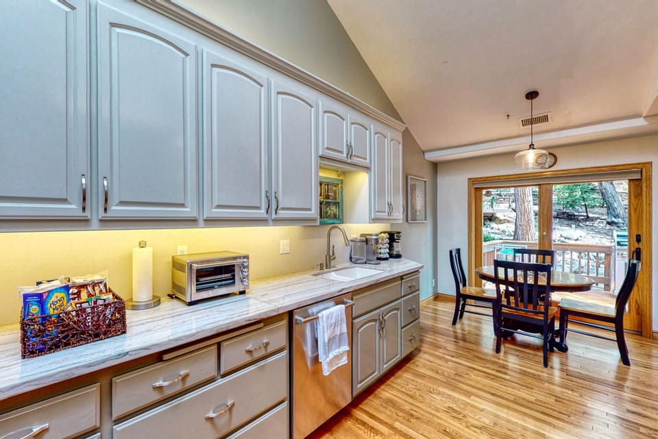 Modern kitchen with access to outdoor deck.