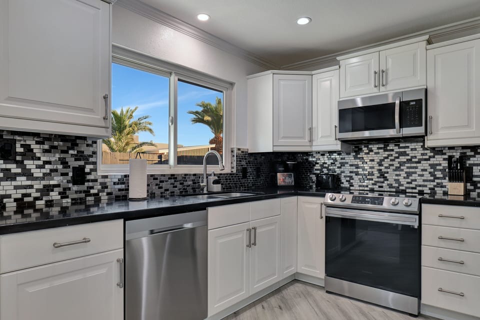 Gorgeous kitchen with stainless appliances.