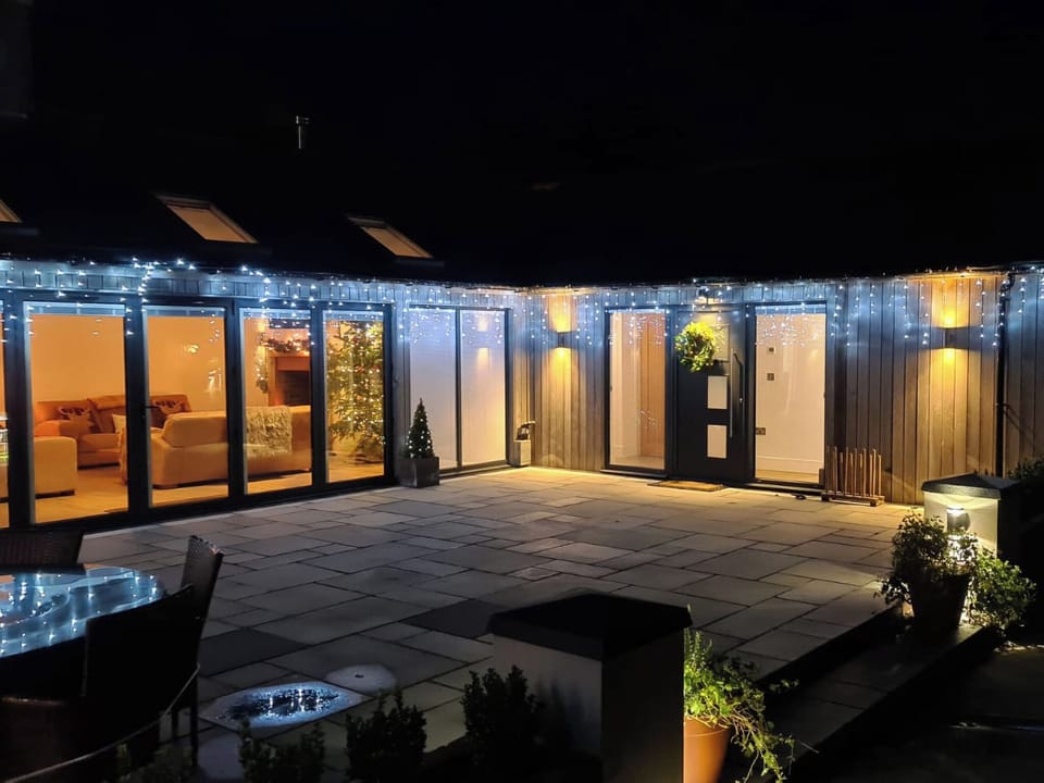 Outdoor area illuminate in the evening | Farmhouse Cottage - Colley Mill Farm, North Rode