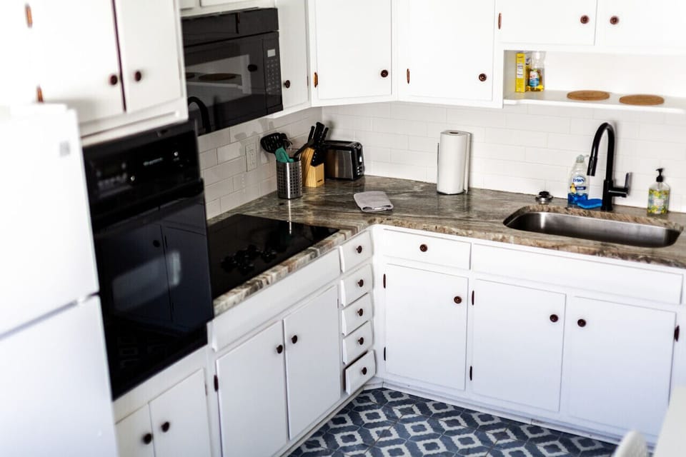 Cook up your favorite meals in style! Our fully-equipped kitchen features a fridge, freezer, microwave, oven, electric stove, Keurig & drip coffee maker combo, and more.