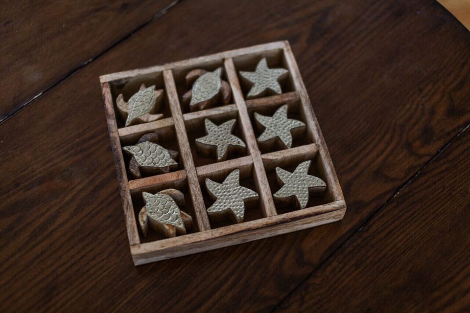 Unwind in our cozy living room with ample comfy seating, a beachy tic-tac-toe game, and a flat screen Roku TV. Board games add extra fun to your stay!