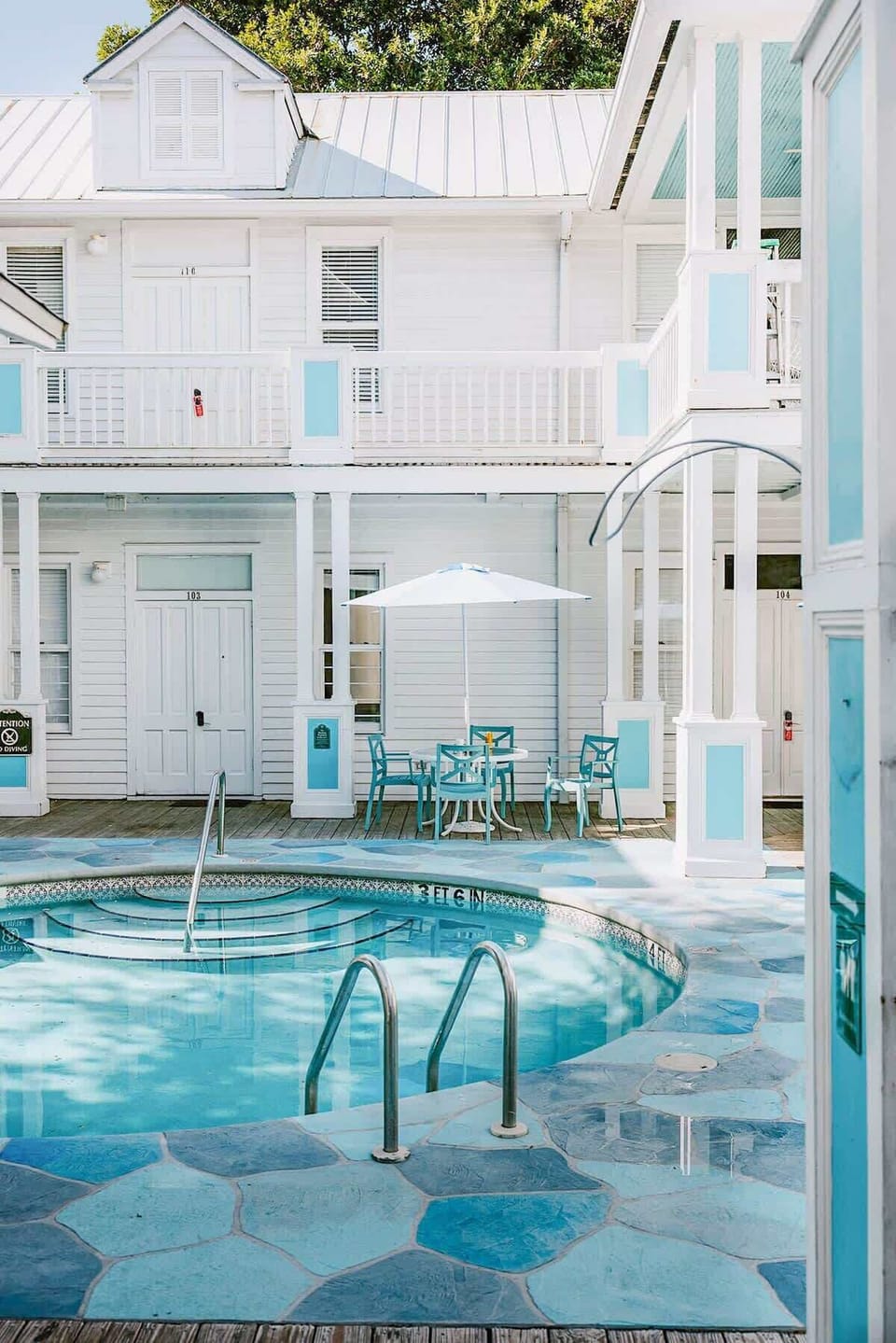 The shared courtyard with lounge surrounding the pool.