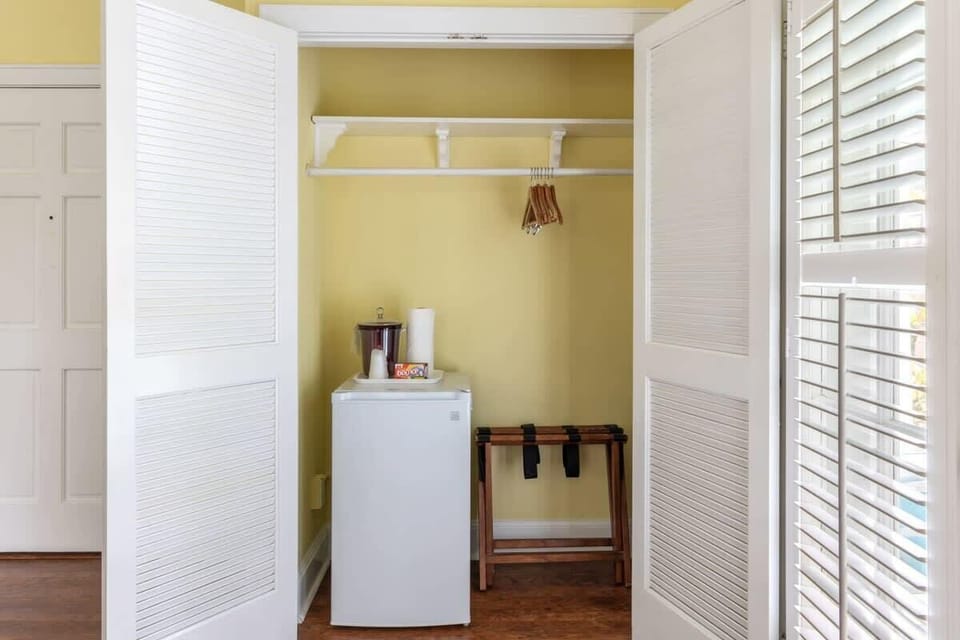 Mini fridge and closet with hanging storage
