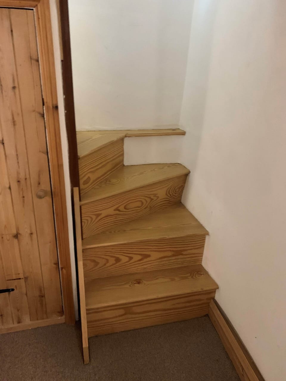 Bottom of the stairs in basement bedroom