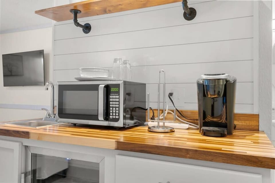 Our kitchenette features a microwave, keurig, and mini fridge. 