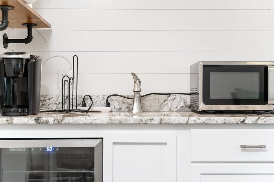 Our kitchenette features a microwave, keurig, and mini fridge. 