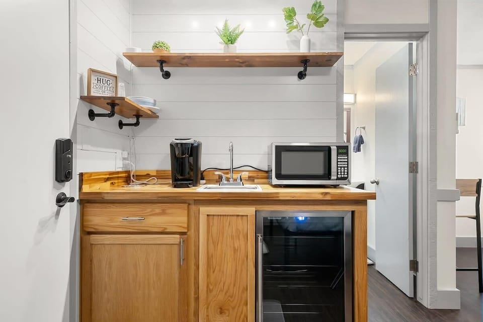Our kitchenette features a microwave, keurig, and mini fridge. 