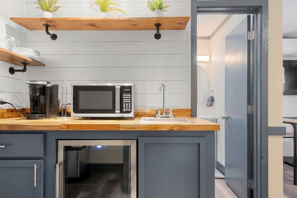 Our kitchenette features a microwave, keurig, and mini fridge. 