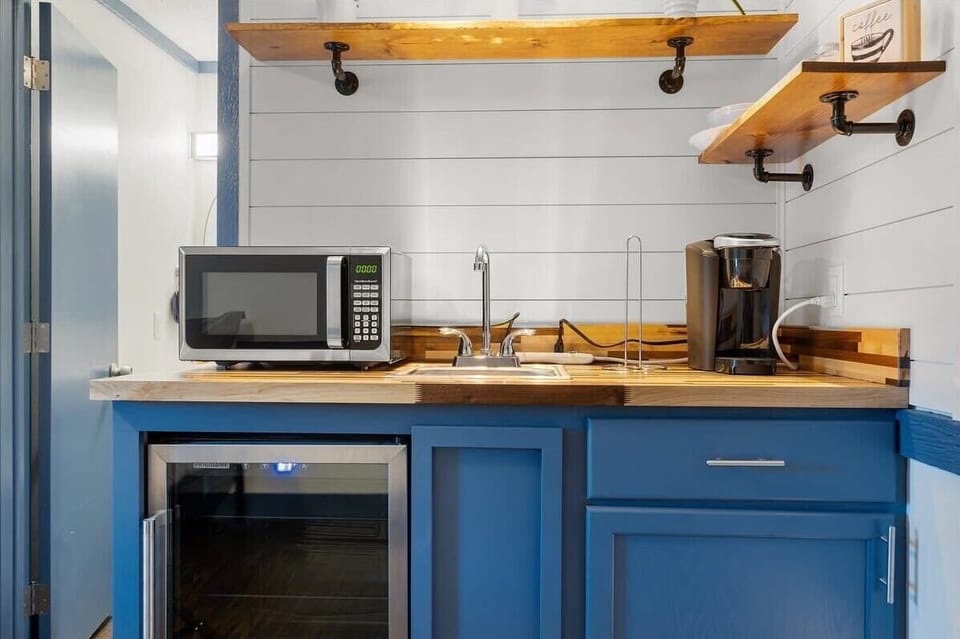 Our kitchenette features a microwave, keurig, and mini fridge. 
