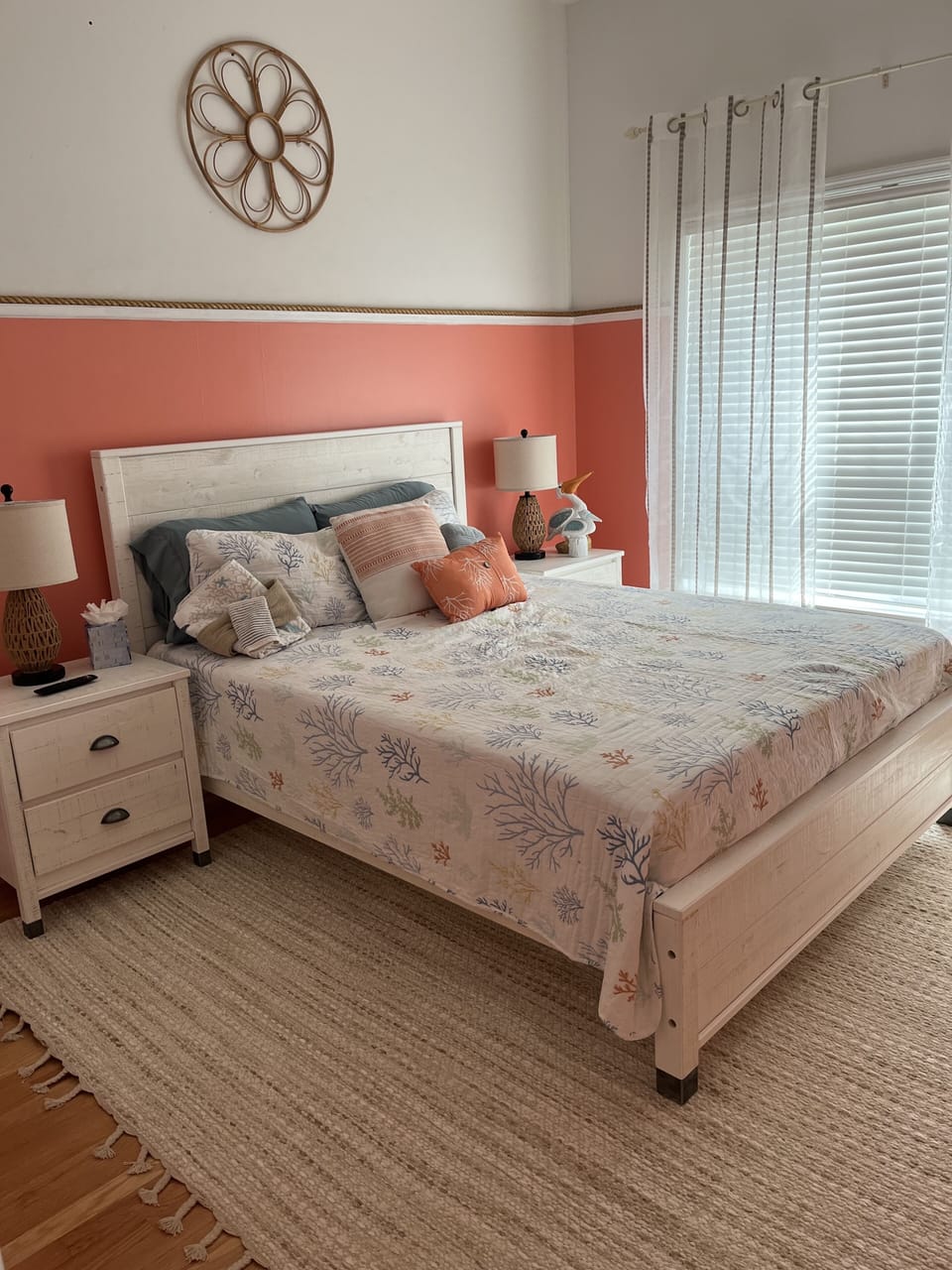 First floor guest bedroom with a queen bed and Smart TV.