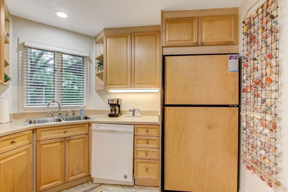 The full sized fridge has a built in icemaker.