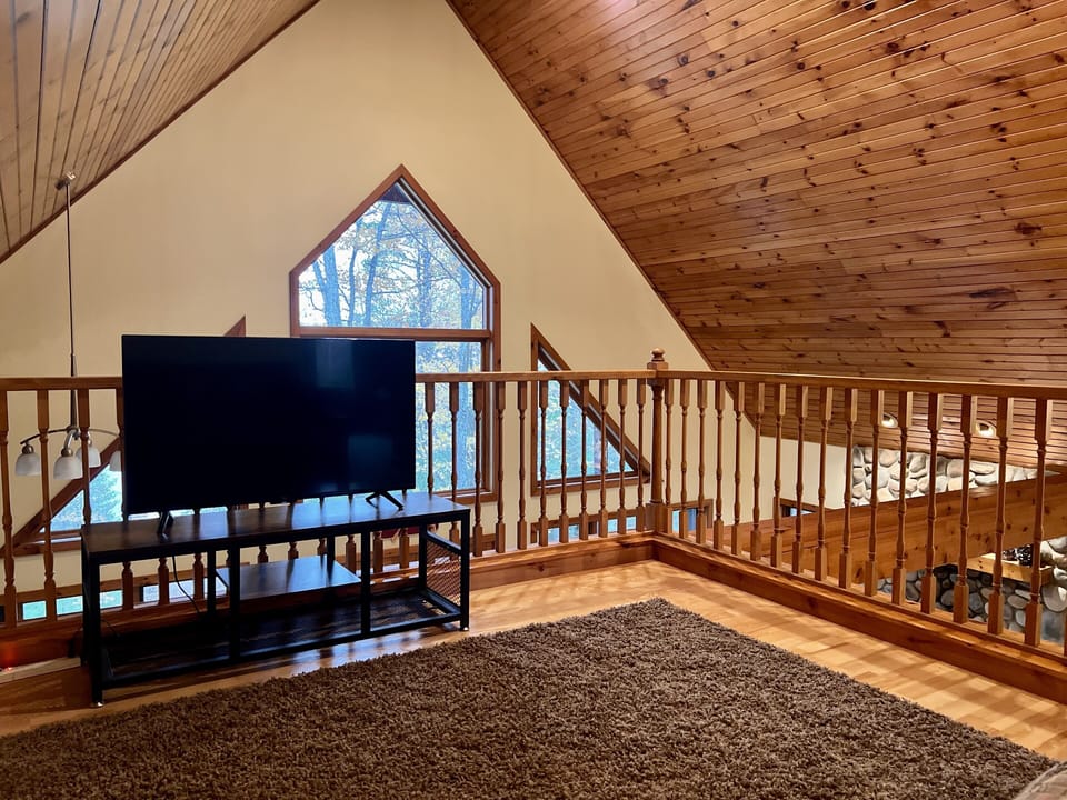 The upstairs loft overlooks the dining and living room below.