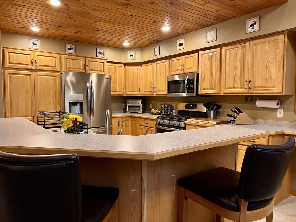Kitchen with updated appliances provides plenty of room to prepare your meals. 