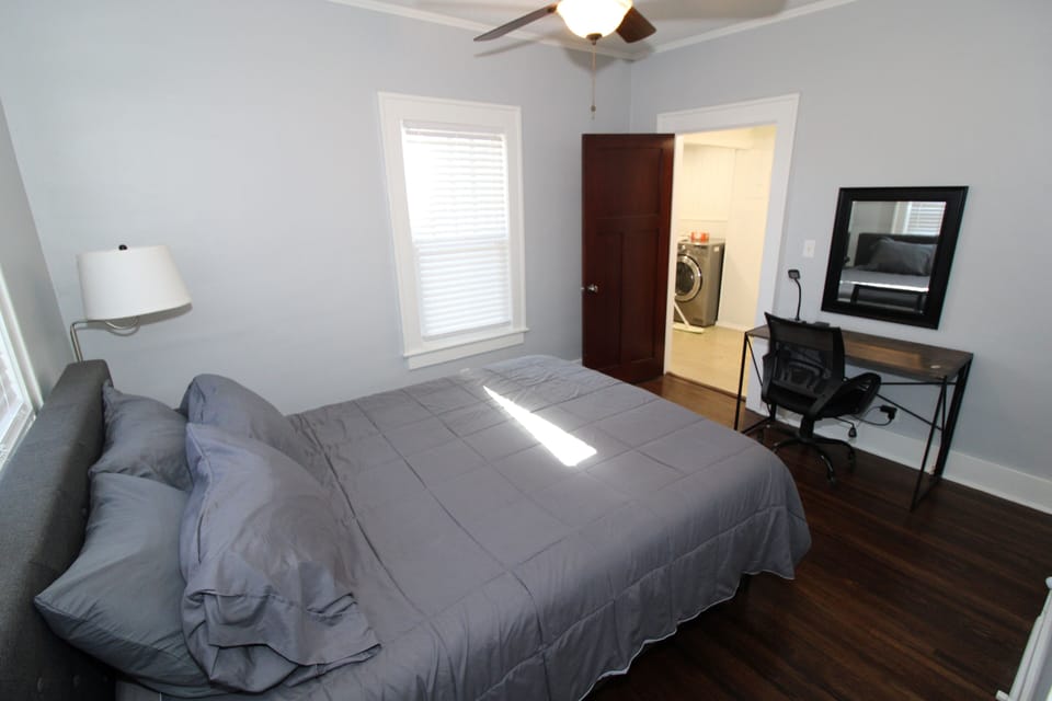 Queen bedroom has a desk with mirror to use as a vanity or work space