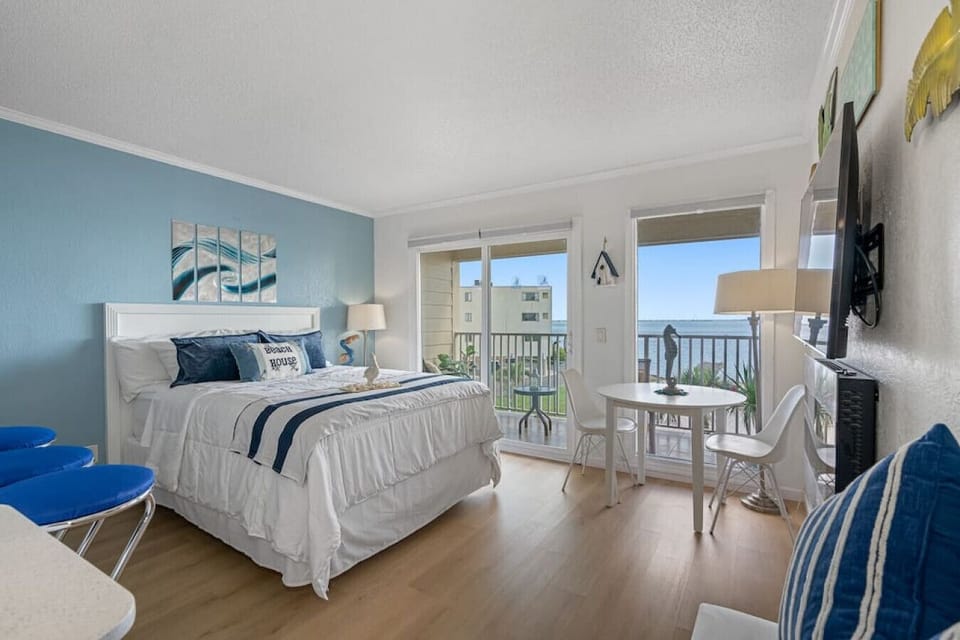 The room has direct access to both the kitchen and the balcony
