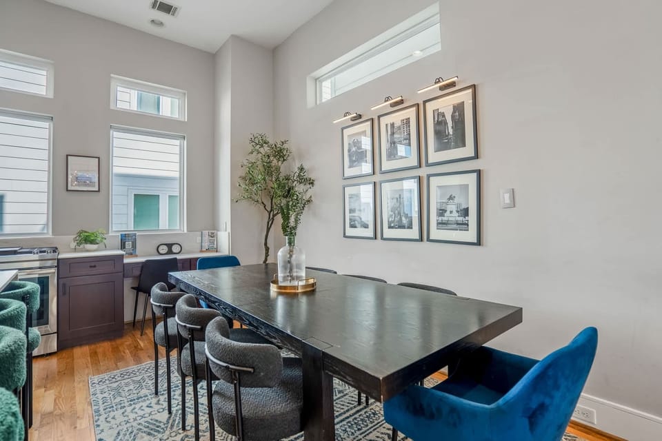 Dining table includes seating for 8 alongside the island bar which seats 4.