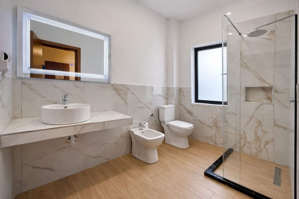 Spacious King + Single Room | Desk, laptop workspace, blackout drapes, free WiFi