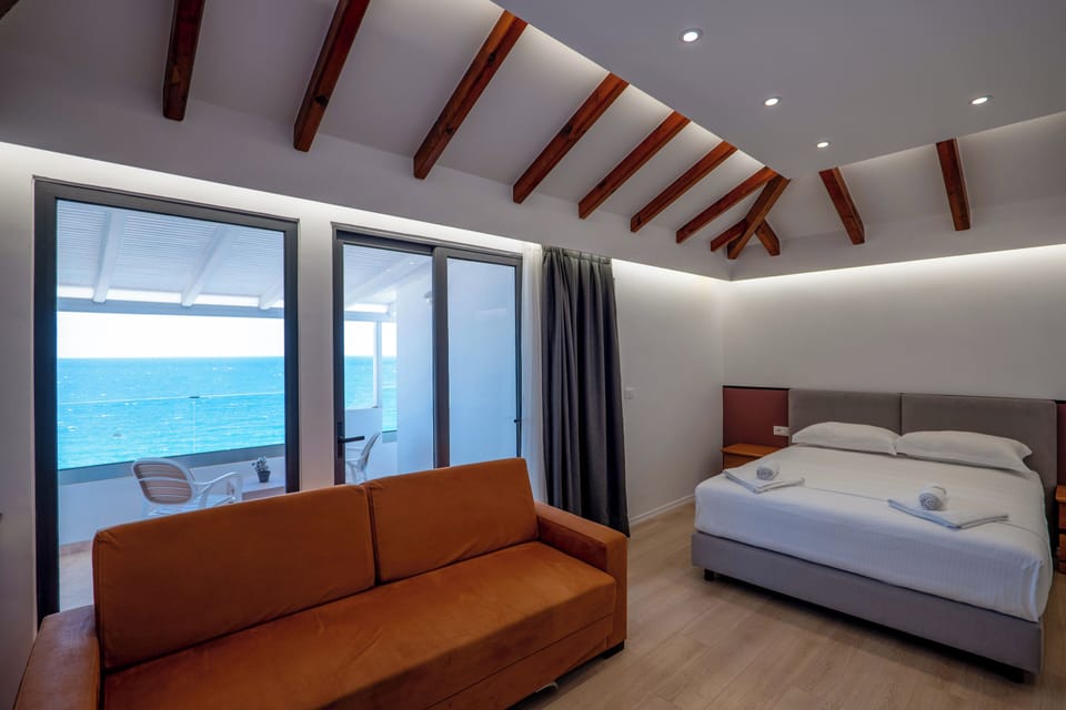 Superior Triple, Sea View | Hypo-allergenic bedding, desk, free WiFi, bed sheets
