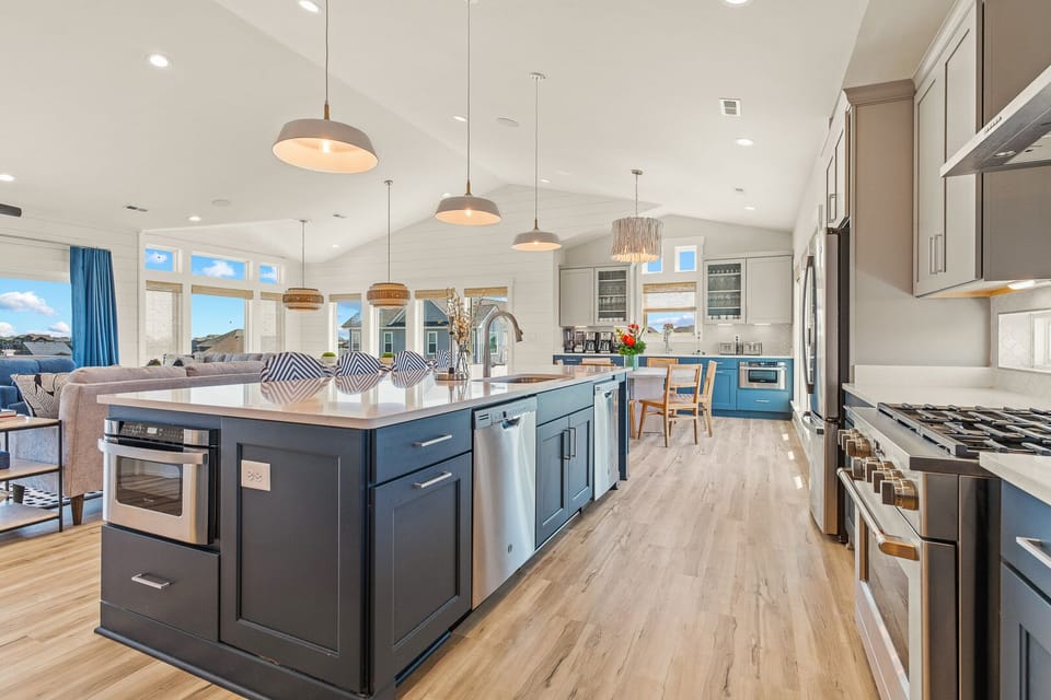 Kitchen with Bar Stool Seating on Third Level