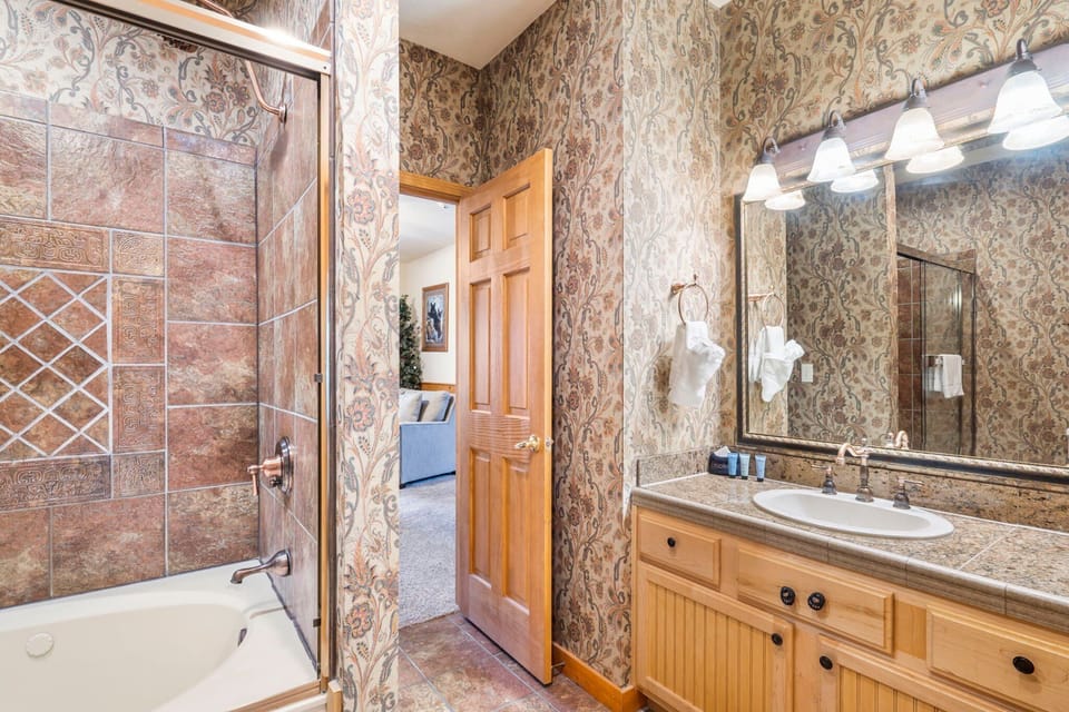 Main Level Bathroom with Jetted Tub and Shower Combo