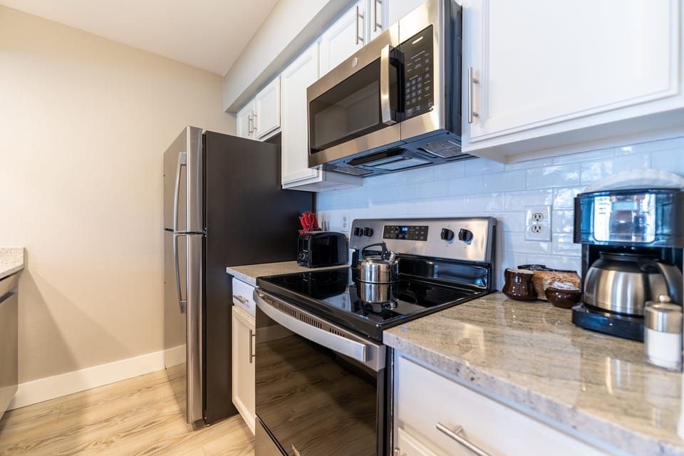 Your fully equipped kitchen features stainless steel appliances and granite countertops, perfect for preparing meals during your stay.