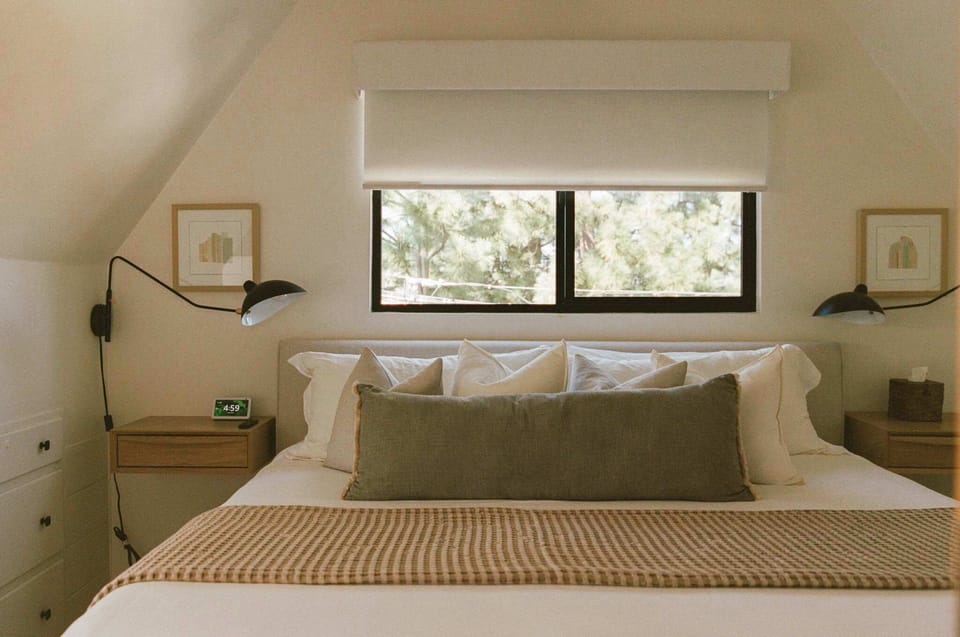 Modern luxury meets comfort in our stylish king bedroom. Immerse yourself in sleek design and premium linens for a dreamy night's sleep. ✨