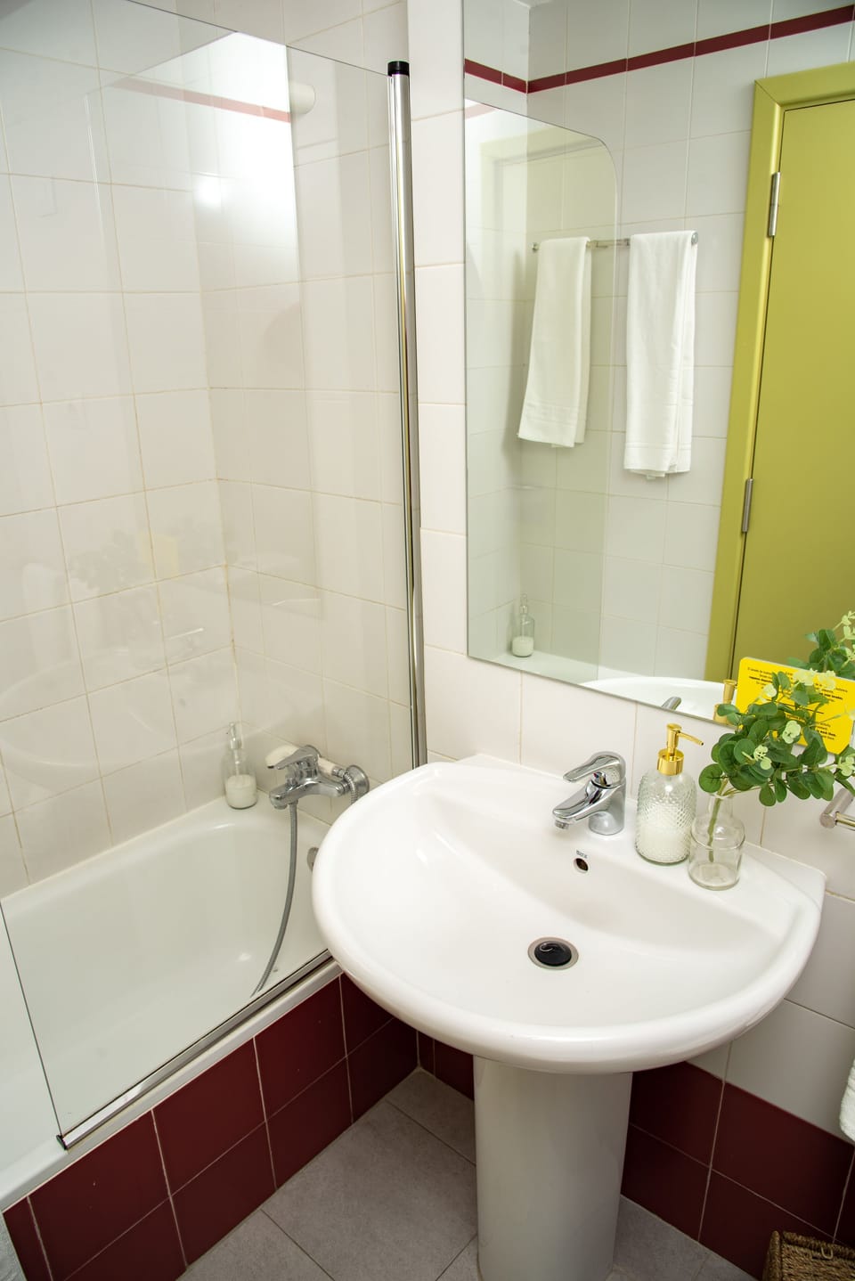 Bathtub, hair dryer, towels, soap