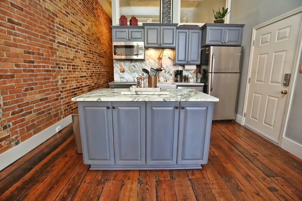 Beautiful, new, fully-equipped kitchen with marble, stainless steel, custom hardware, induction stove, dishwasher, fridge, freezer, coffee maker, microwave, island, and everything you need to make delicious meals. Table for 8 for dining.