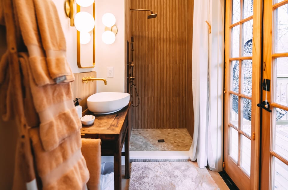 Style & function rule in this adorable bath, including a rainfall shower