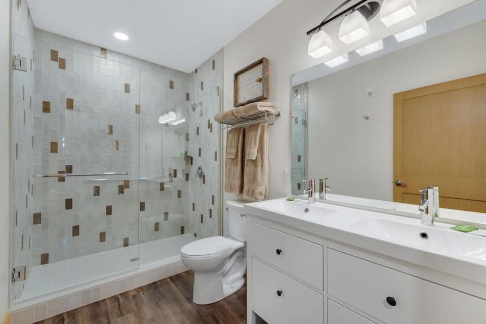 Complete with a double sink, oversized tile walk-in shower, towels, toiletries, and a hair dryer, you`ll have everything you need. And if you need anything else, just let us know.
