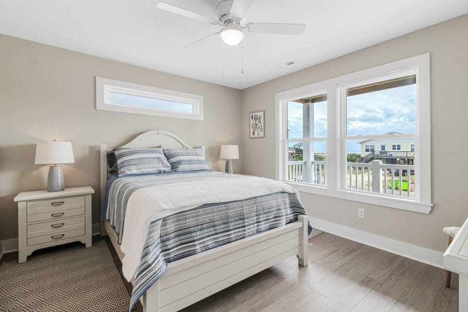 Guest bedroom #4 with a comfortable queen size bed