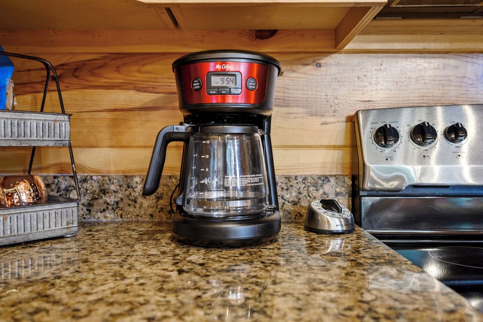 Start your mornings with fresh coffee brewed right in your fully-equipped kitchen, complete with modern appliances and granite countertops.